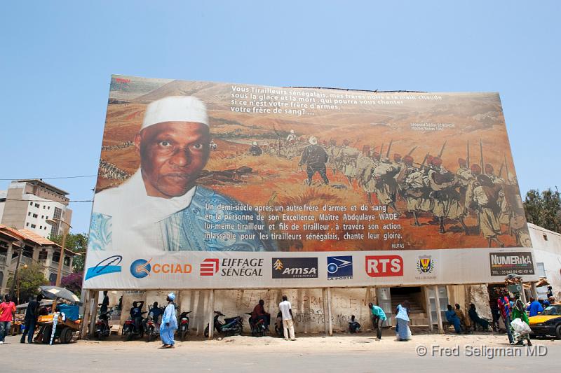 20090528_122759 D3 P1 P1.jpg - Center city billboard commemorating the 50th anniversary of the revolution that culminated in the independence of Senegal. Abdoulaye Wade is the current President of Senegal